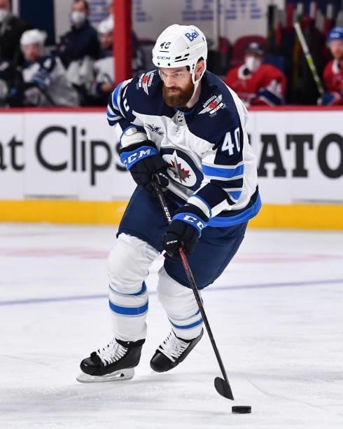 Jordie Benn of the Winnipeg Jets skates the puck against the Montreal Canadiens during the second period in Game Three of the Second Round of the...