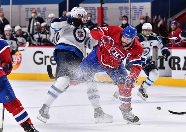 Shea Weber of the Montreal Canadiens checks Pierre-Luc Dubois of the Winnipeg Jets during the third period in Game Three of the Second Round of the...
