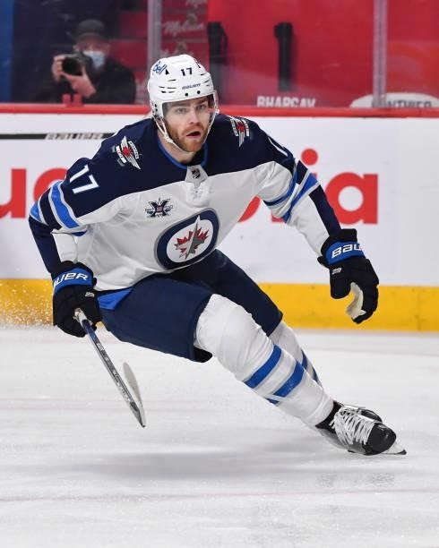 Adam Lowry of the Winnipeg Jets skates against the Montreal Canadiens during the first period in Game Three of the Second Round of the 2021 Stanley...