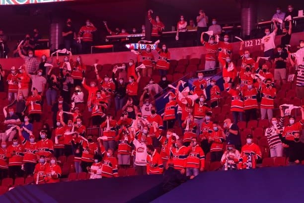 Fans cheer during the pre-game ceremony between the Montreal Canadiens and the Winnipeg Jets in Game Three of the Second Round of the 2021 Stanley...