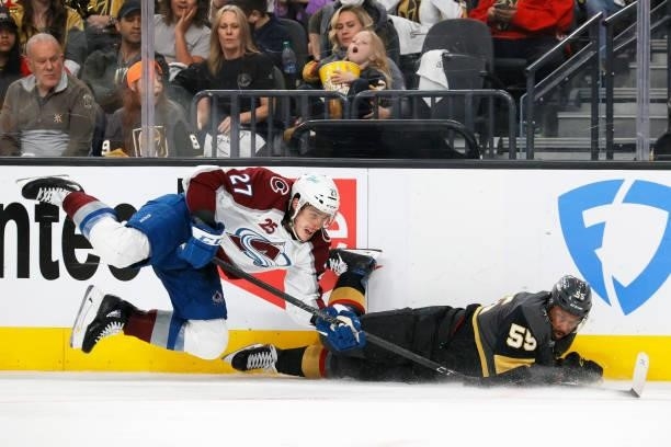 Ryan Graves of the Colorado Avalanche falls to the ice after hitting Keegan Kolesar of the Vegas Golden Knights in the second period in Game Four of...