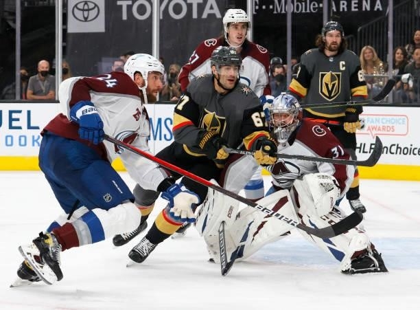 Patrik Nemeth of the Colorado Avalanche and Max Pacioretty of the Vegas Golden Knights look for a rebound after Philipp Grubauer of the Avalanche...