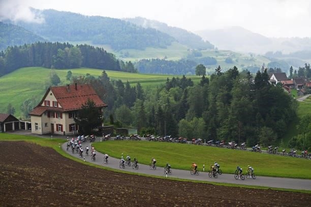 The peloton passing through Ghöch pass landscape during the 84th Tour de Suisse 2021, Stage 2 a 178km stage from Neuhausen am Rheinfall to Lachen /...
