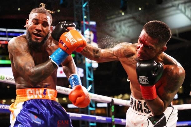 Luis Arias punches Jarrett Hurd during their junior middleweight boxing match at Hard Rock Stadium on June 06, 2021 in Miami Gardens, Florida.