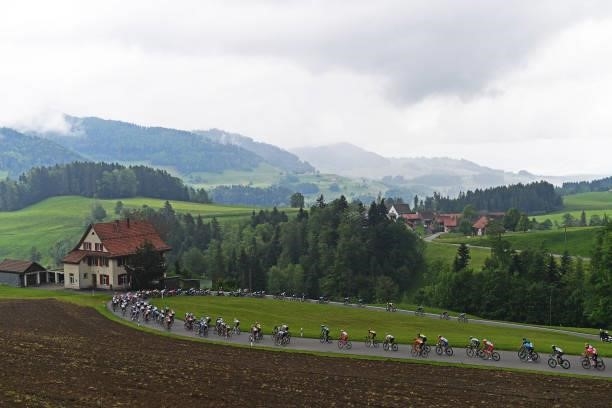 Stefan Küng of Switzerland and Team Groupama - FDJ Yellow Leader Jersey & The peloton passing through Ghöch pass landscape during the 84th Tour de...