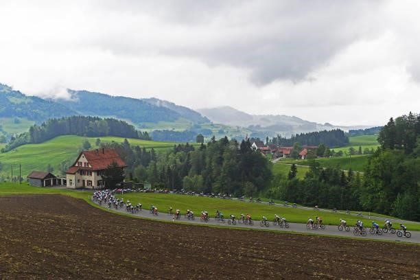 Stefan Küng of Switzerland and Team Groupama - FDJ Yellow Leader Jersey & The peloton passing through Ghöch pass landscape during the 84th Tour de...