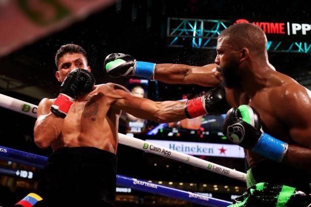 Badou Jack punches Dervin Colina during their light heavyweight boxing match at Hard Rock Stadium on June 06, 2021 in Miami Gardens, Florida.