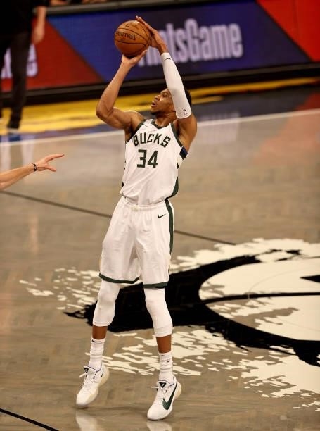 Giannis Antetokounmpo of the Milwaukee Bucks shoots a three in the first quarter against the Brooklyn Nets during game two of the Eastern Conference...