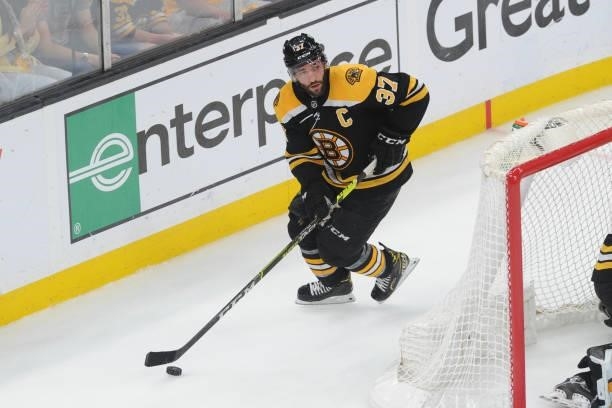 Patrice Bergeron of the Boston Bruins skates with the puck against the New York Islanders in Game Five of the Second Round of the 2021 Stanley Cup...