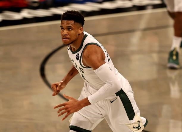 Giannis Antetokounmpo of the Milwaukee Bucks reacts after a three point shot in the second half against the Brooklyn Nets during game two of the...