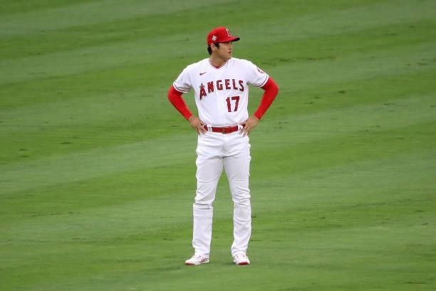 Shohei Ohtani of the Los Angeles Angels looks on during warm-ups before the game against the Kansas City Royals at Angel Stadium of Anaheim on June...