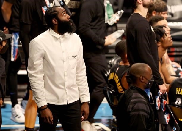James Harden of the Brooklyn Nets looks on from the bench during game two of the Eastern Conference second round series against the Milwaukee Bucks...