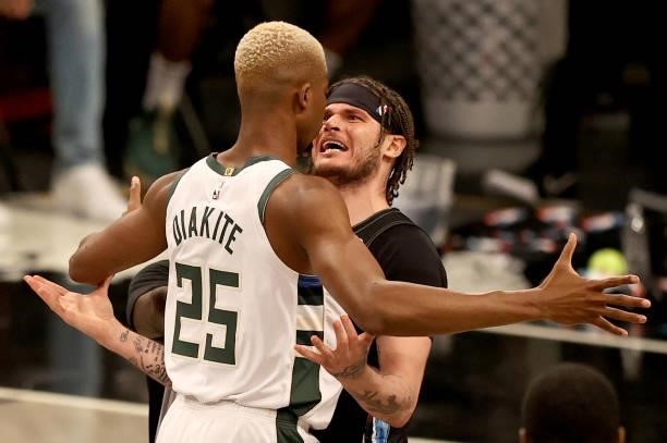 Mamadi Diakite of the Milwaukee Bucks and Tyler Johnson of the Brooklyn Nets exchange words after Diakite was called for a flagrant foul in the...