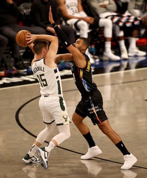 Sam Merrill of the Milwaukee Bucks tries to pass around Timothe Luwawu-Cabarrot of the Brooklyn Nets in the fourth quarter during game two of the...