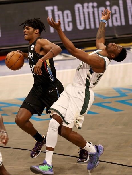 Alize Johnson of the Brooklyn Nets and Thanasis Antetokounmpo of the Milwaukee Bucks collide during game two of the Eastern Conference second round...