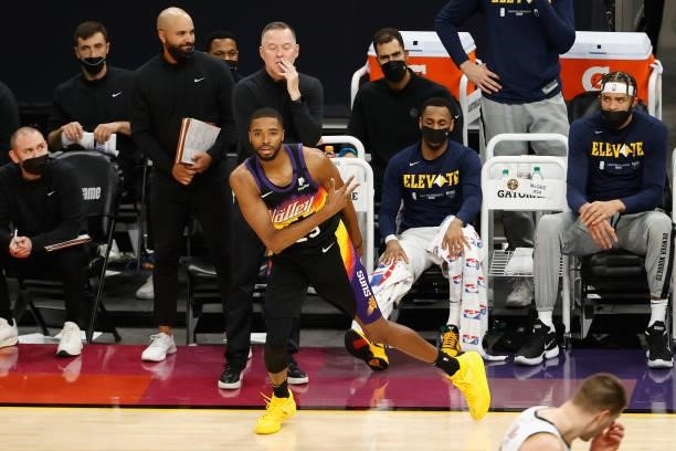 Mikal Bridges of the Phoenix Suns reacts to a three-point shot against the Denver Nuggets during the second half in Game One of the Western...