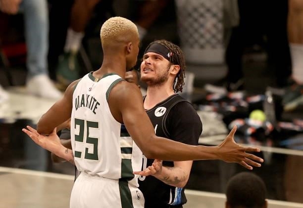 Mamadi Diakite of the Milwaukee Bucks and Tyler Johnson of the Brooklyn Nets exchange words after Diakite was called for a flagrant foul in the...