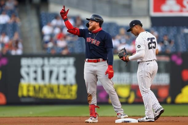Alex Verdugo of the Boston Red Sox gestures after he hit a double against the New York Yankees during the first inning of a game at Yankee Stadium on...