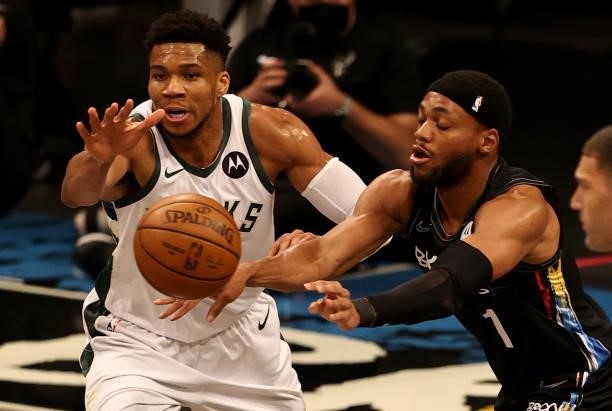 Bruce Brown of the Brooklyn Nets passes the ball as Giannis Antetokounmpo of the Milwaukee Bucks defends during game two of the Eastern Conference...