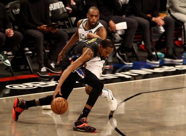 Kevin Durant of the Brooklyn Nets loses control of the ball as Khris Middleton of the Milwaukee Bucks defends in the first half during game two of...
