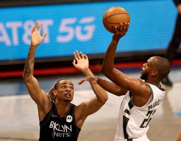 Khris Middleton of the Milwaukee Bucks takes a shot as Nicolas Claxton of the Brooklyn Nets defends during game two of the Eastern Conference second...