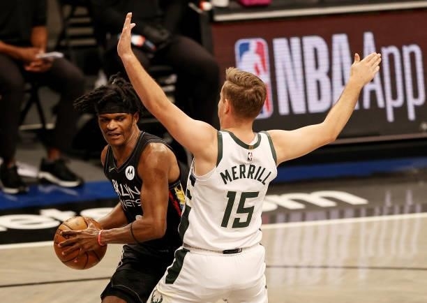 Alize Johnson of the Brooklyn Nets tries to get around Sam Merrill of the Milwaukee Bucks in the fourth quarter during game two of the Eastern...