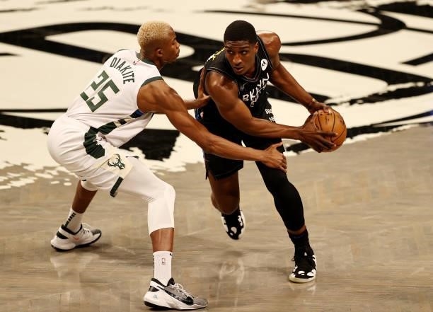 Reggie Perry of the Brooklyn Nets tries to get past Mamadi Diakite of the Milwaukee Bucks in the fourth quarter during game two of the Eastern...