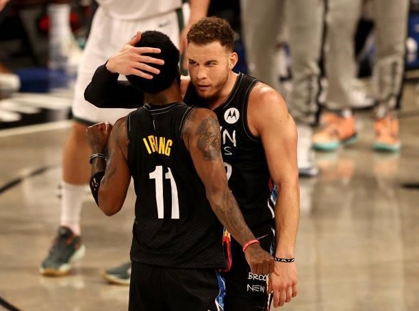 Blake Griffin of the Brooklyn Nets congratulates Kyrie Irving in the first half against the Milwaukee Bucks during game two of the Eastern Conference...