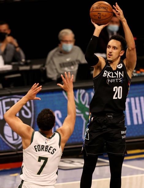 Landry Shamet of the Brooklyn Nets takes a three point shot as Bryn Forbes of the Milwaukee Bucks defends during game two of the Eastern Conference...
