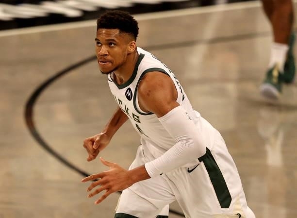 Giannis Antetokounmpo of the Milwaukee Bucks reacts after he made a three point basket in the second half against the Brooklyn Nets during game two...