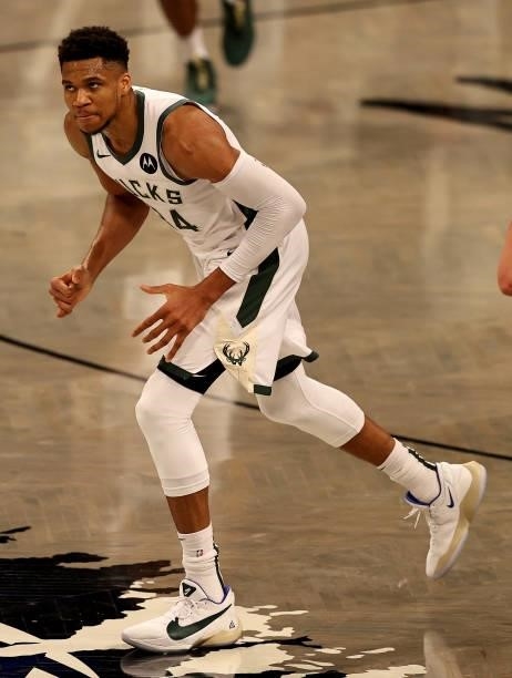 Giannis Antetokounmpo of the Milwaukee Bucks reacts after he made a three point basket in the second half against the Brooklyn Nets during game two...