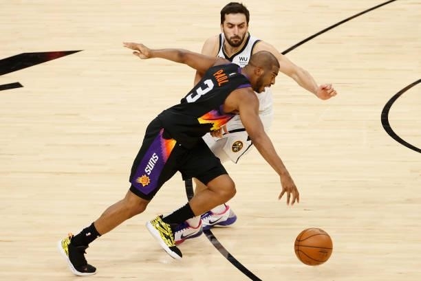 Chris Paul of the Phoenix Suns drives the ball past Facundo Campazzo of the Denver Nuggets during the second half in Game One of the Western...