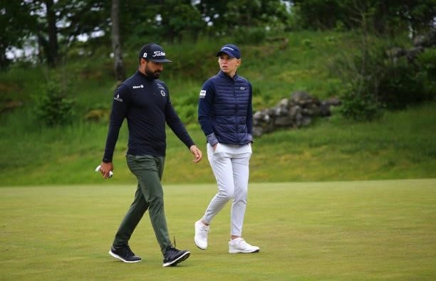 Camille Chevalier of France and Francesco Laporta of Italy interact during a practice round ahead of the Scandinavian Mixed Hosted by Henrik and...