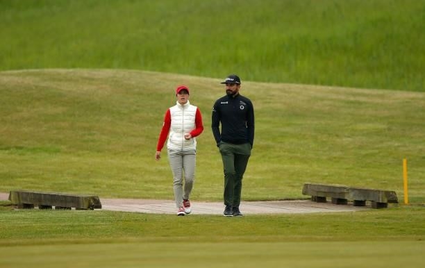 Lucrezia Colombotto Rosso of Italy and Francesco Laporta of Italy interact during a practice round ahead of the Scandinavian Mixed Hosted by Henrik...