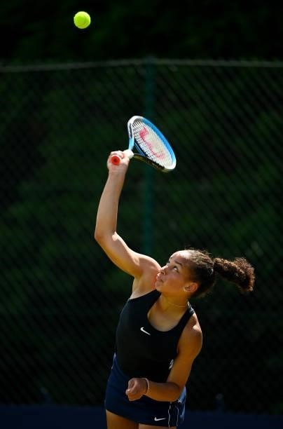 Sofia Johnson serves during her match against Kylie Bilchev during the Junior National Tennis Championships at Surbiton Racket & Fitness Club on June...