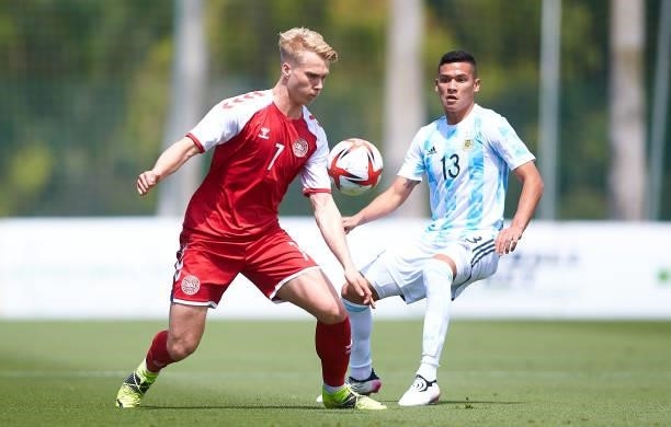 Magnus Warming of Denmark U21 competes for the ball with Marcelo Herrera of Argentina U23 during a Friendly International Match between Denmark and...