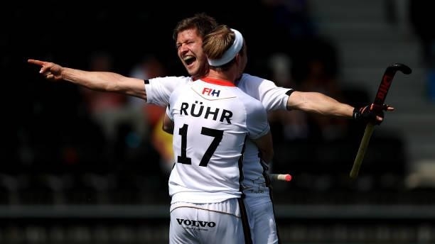 Martin Haener of Germany celebrates scoring the 6th and winning goal in the final second with team mate Christopher Ruehr during the Euro Hockey...