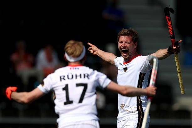 Martin Haener of Germany celebrates scoring the 6th and winning goal in the final second with team mate Christopher Ruehr during the Euro Hockey...