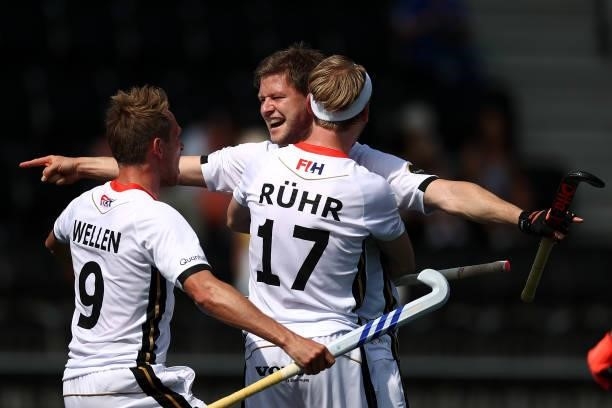 Martin Haener of Germany celebrates scoring the 6th and winning goal in the final second with team mates Niklas Wellen and Christopher Ruehr during...
