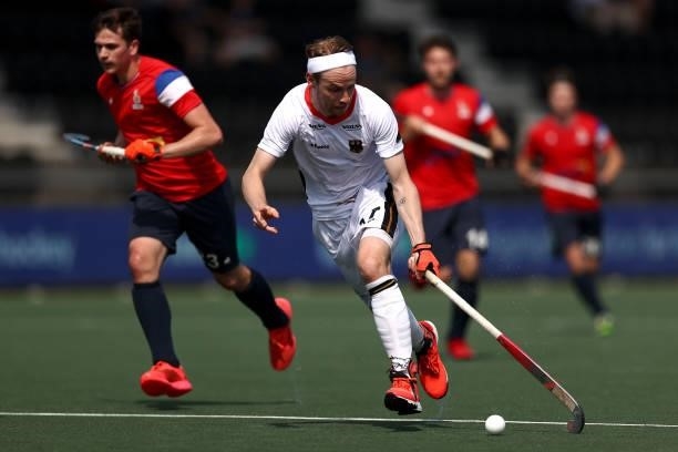 Christopher Ruehr of Germany gets past the tackle from Benjamin Marque of France during the Euro Hockey Championships Men match between France and...