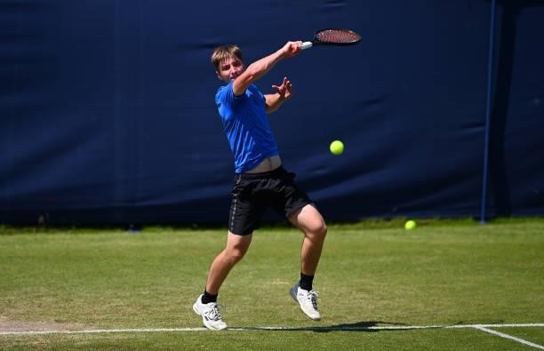 Alexander Knox-Jones hits a forehand during his match against William Nolan during the Junior National Tennis Championships at Surbiton Racket &...