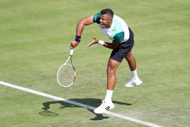Jay Clarke of Great Britain serves against Kevin Anderson of South Africa during Day 4 of the Viking Nottingham Open at Nottingham Tennis Centre on...