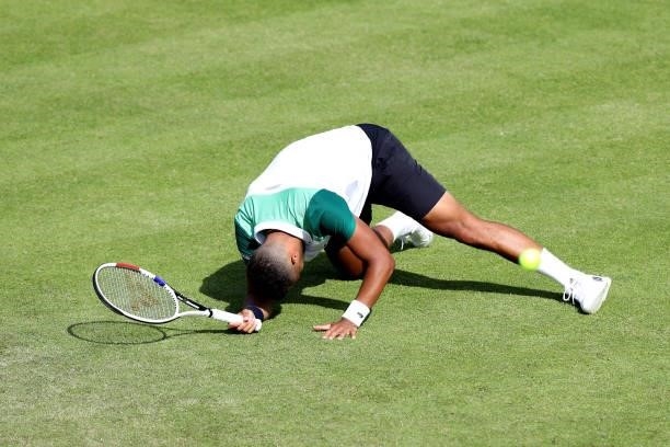 Jay Clarke of Great Britain falls against Kevin Anderson of South Africa during Day 4 of the Viking Nottingham Open at Nottingham Tennis Centre on...