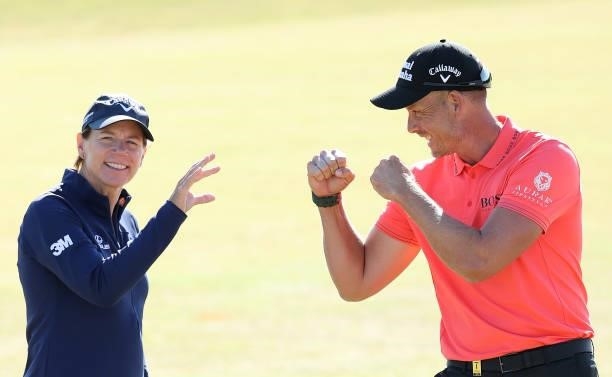 Annika Sorenstam of Sweden flicks away a challenge by Henrik Stenson of Sweden as they pose for a pictured ahead of the Scandinavian Mixed Hosted by...