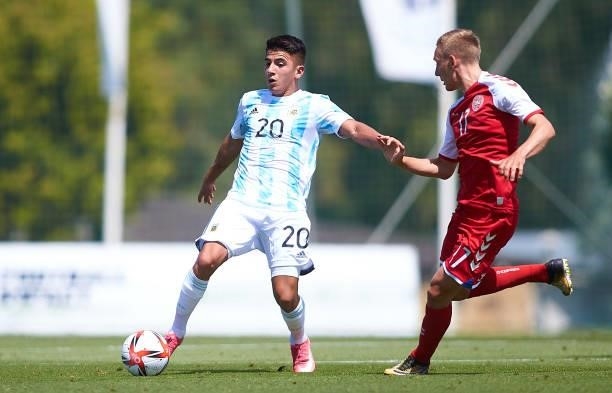Emil Frederiksen of Denmark U21 competes for the ball with Thiago Almada of Argentina U23 during a Friendly International Match between Denmark and...