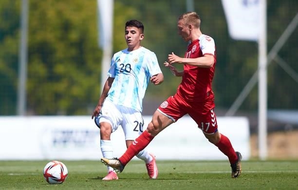 Emil Frederiksen of Denmark U21 competes for the ball with Thiago Almada of Argentina U23 during a Friendly International Match between Denmark and...