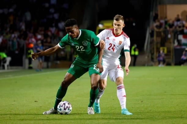 Chiedozie Ogbene of Republic of Ireland is challenged by Szabolcs Schon of Hungary during the international friendly match between Hungary and...
