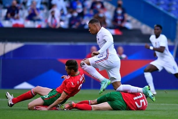 Kylian Mbappe of France runs with the ball during the international friendly match between France and Bulgaria at Stade de France on June 08, 2021 in...