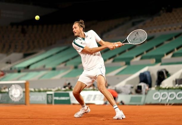 Daniil Medvedev of Russia plays a backhand in their mens singles quarter final match against Stefanos Tsitsipas of Greece during day ten of the 2021...