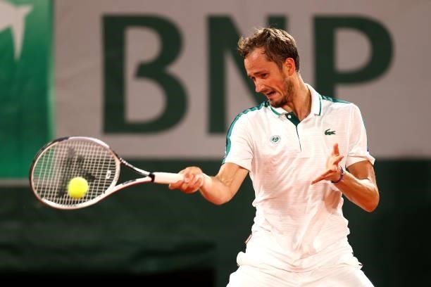 Daniil Medvedev of Russia plays a forehand in their mens singles quarter final match against Stefanos Tsitsipas of Greece during day ten of the 2021...